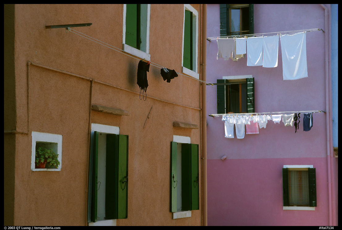 Multicolored houses and hanging laundry, Burano. Venice, Italy