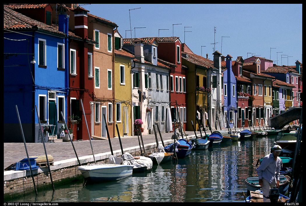 Canal lined with typical brightly painted houses, Burano. Venice, Italy