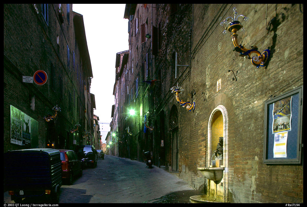Street and fountain at dawn. Siena, Tuscany, Italy