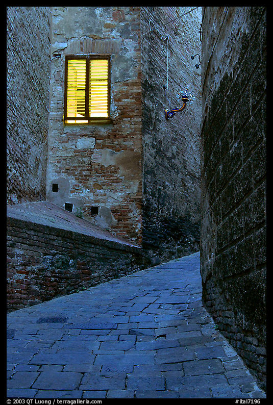 Street and window at dawn. Siena, Tuscany, Italy