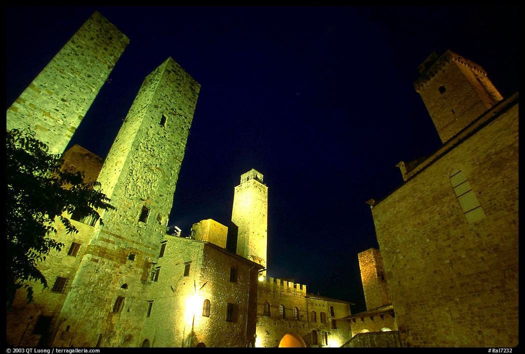 Medieval towers above Piazza del Duomo at night. San Gimignano, Tuscany, Italy