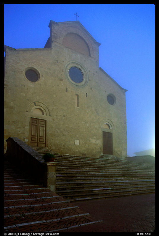 Duomo at dawn in the fog. San Gimignano, Tuscany, Italy