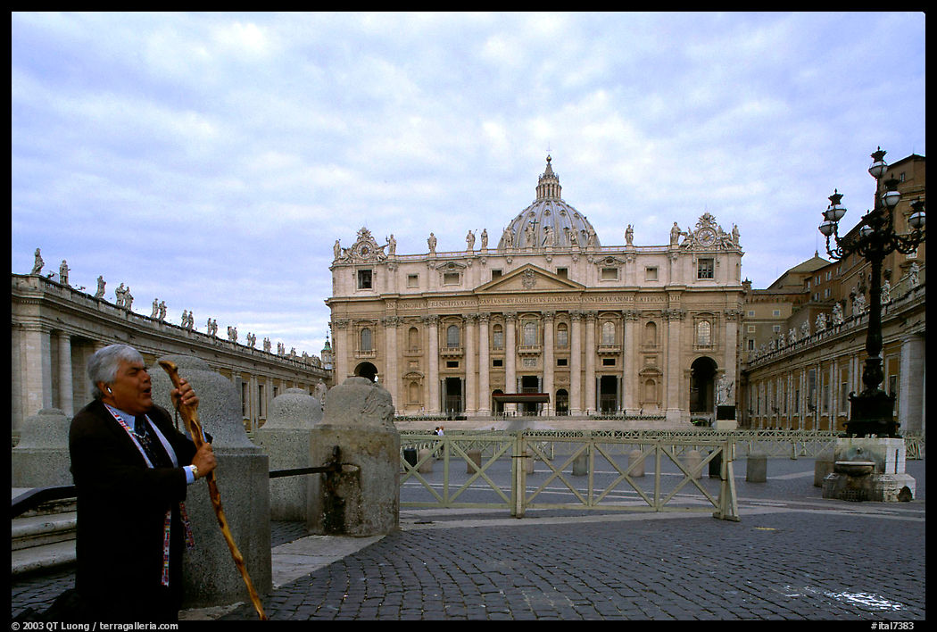 Pilgrim prays in front of the Basilic Saint Peter. Vatican City, Rome, Italy