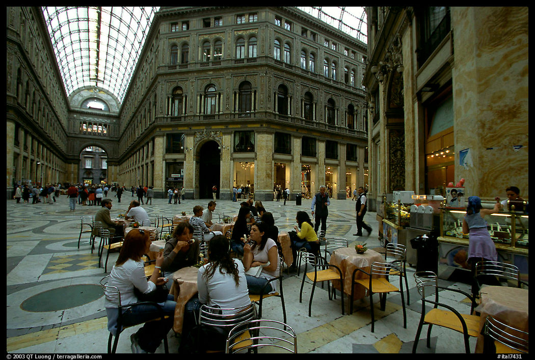 Women enjoy gelato inside the Galleria Umberto I. Naples, Campania, Italy