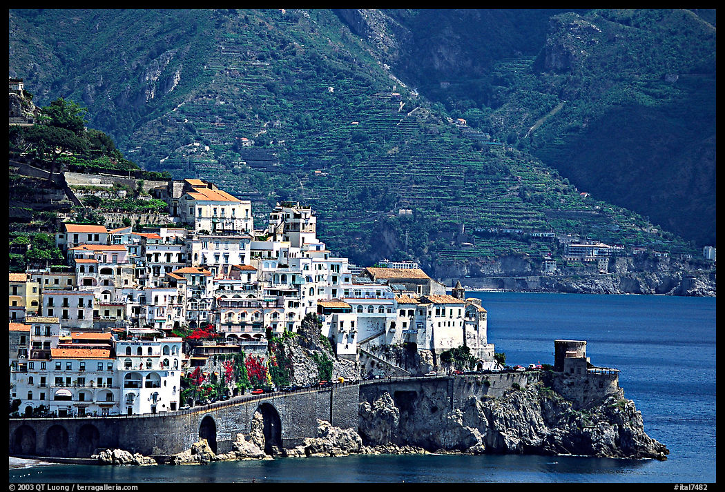 Houses built on a rocky promontory in Amalfi. Amalfi Coast, Campania, Italy