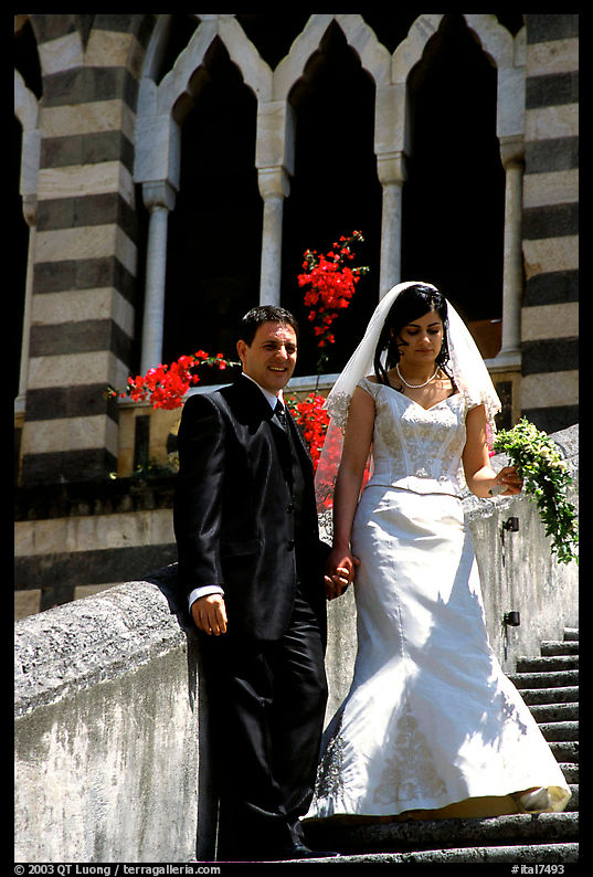 Newly wed couple on the stairs of Duomo Sant'Andrea, Amalfi. Amalfi Coast, Campania, Italy