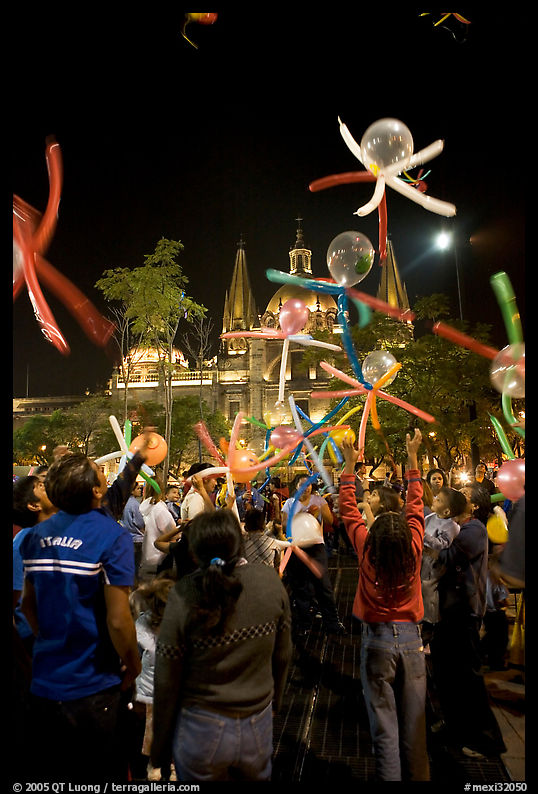 Children playing with ballons behind the Cathedral on  Plaza de la Liberacion. Guadalajara, Jalisco, Mexico
