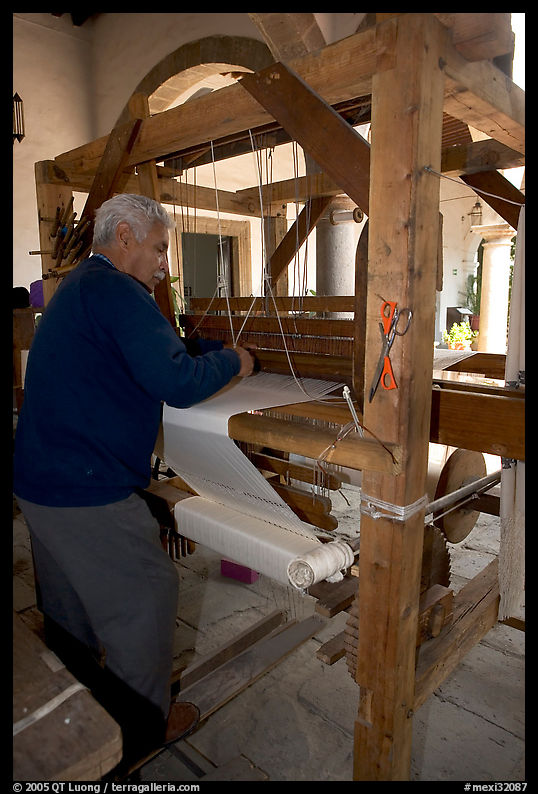 Traditional weaver and machine seen from the back, Tlaquepaque. Jalisco, Mexico