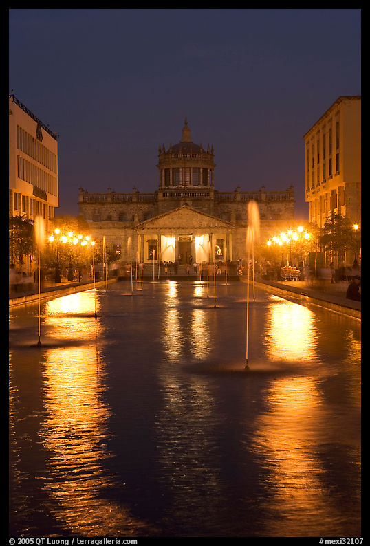 Plaza Tapatia at night with Hospicio Cabanas reflected in basin. Guadalajara, Jalisco, Mexico