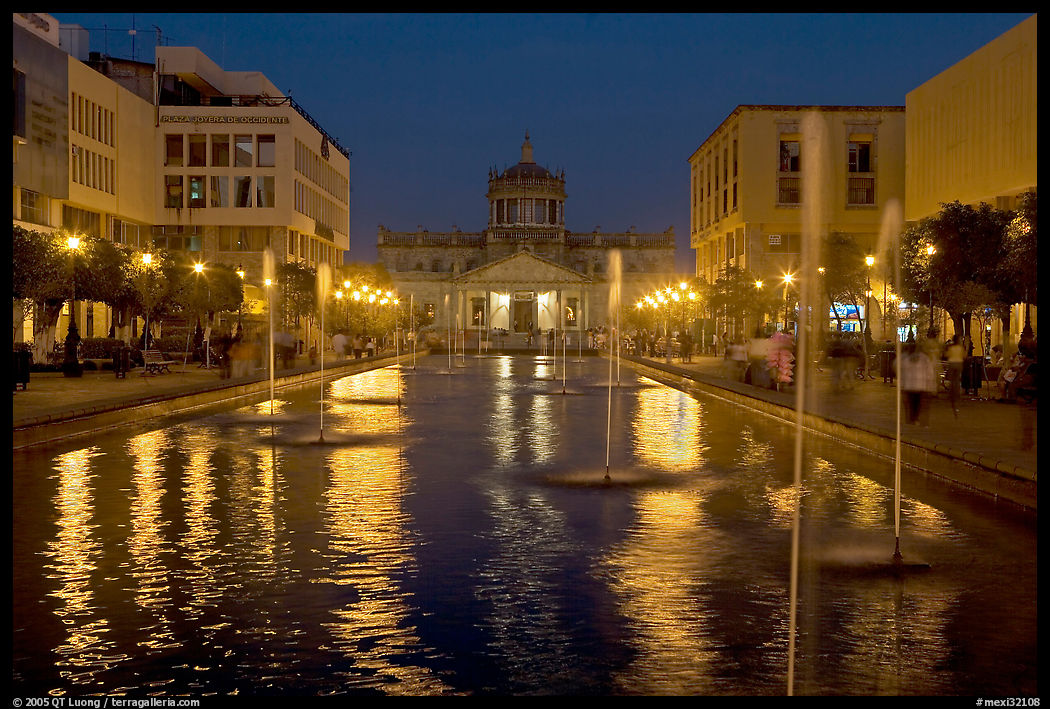 Plaza Tapatia at night with Hospicio Cabanas reflected in basin. Guadalajara, Jalisco, Mexico