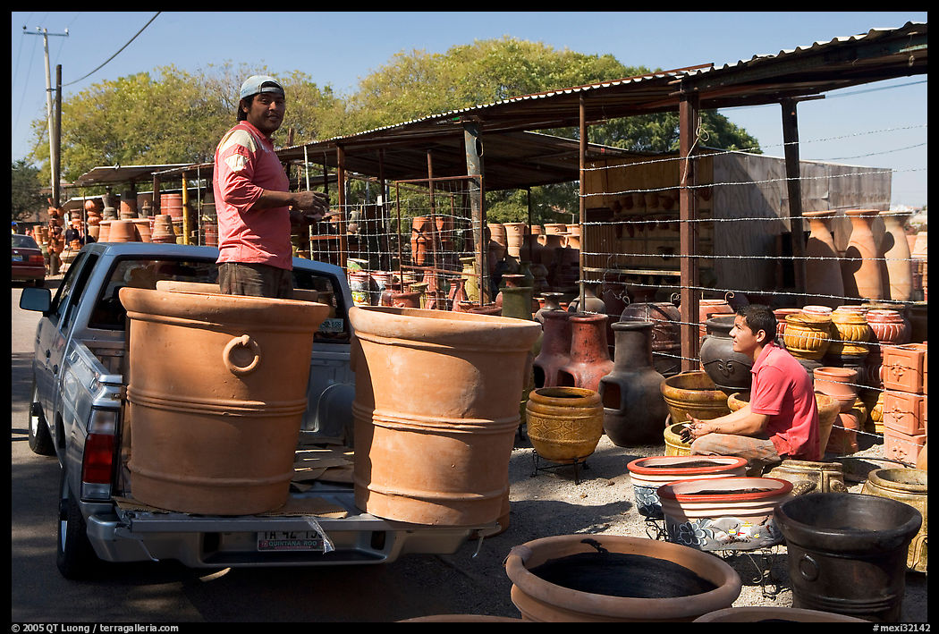Pots being loaded on the back of a pick-up truck, Tonala. Jalisco, Mexico