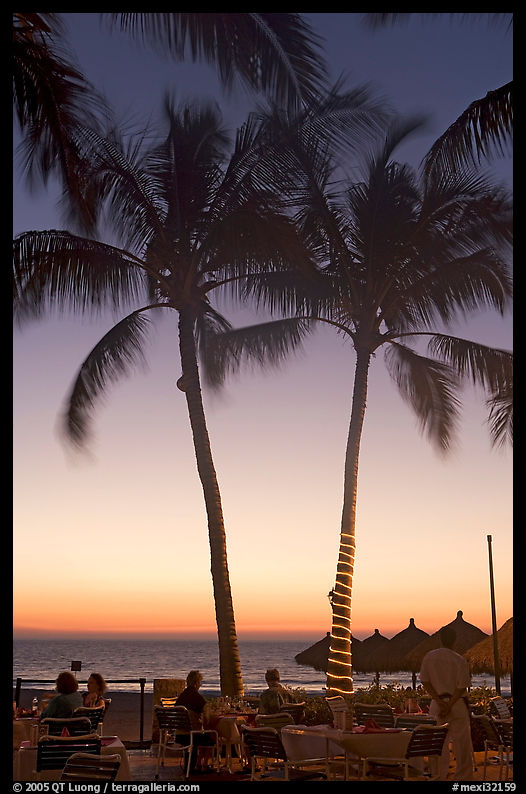 Outdoor restaurant with palm trees at sunset, Nuevo Vallarta, Nayarit. Jalisco, Mexico