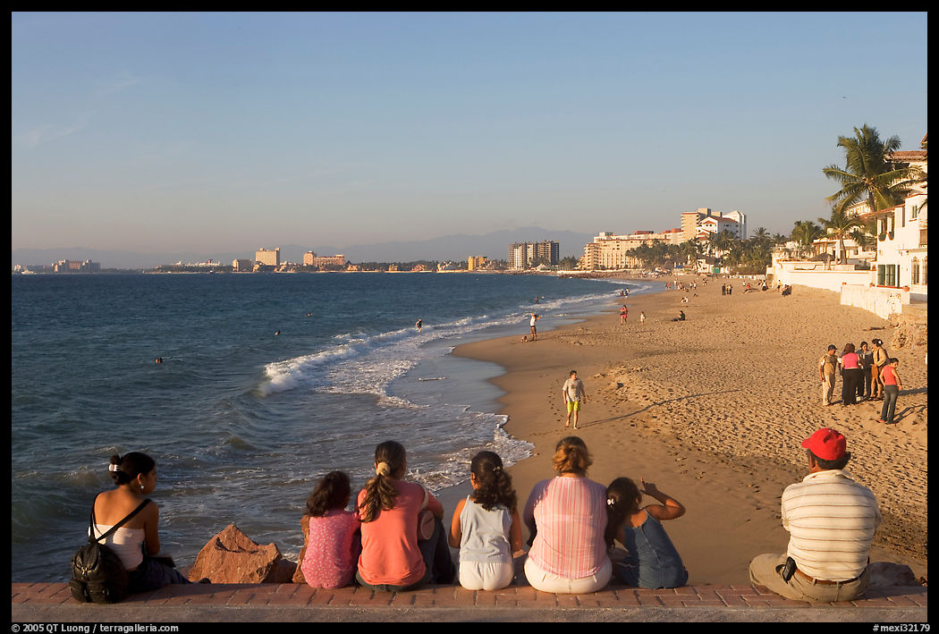 Family sitting above the beach, late afternoon, Puerto Vallarta, Jalisco. Jalisco, Mexico