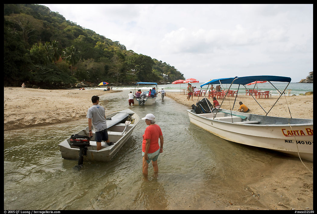 Boats moving from a lagoon to the ocean via a small channel, Jalisco. Jalisco, Mexico