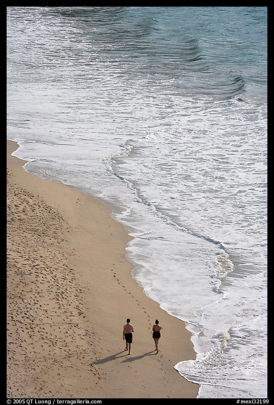Couple walking on the beach seen from above, Puerto Vallarta, Jalisco. Jalisco, Mexico