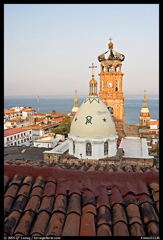 Red tile roof, Templo de Guadalupe Cathedral, and ocean early morning, Puerto Vallarta, Jalisco. Jalisco, Mexico