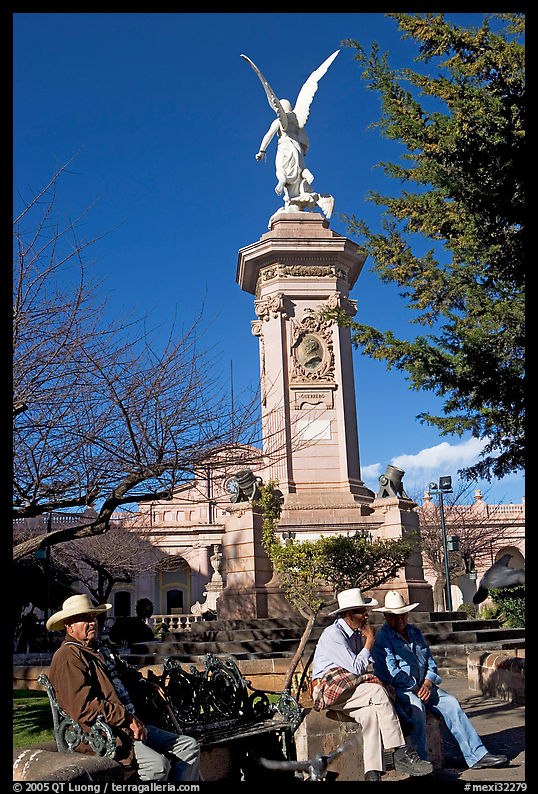 Men wearing cow-boy hats sitting in Garden of Independencia. Zacatecas, Mexico