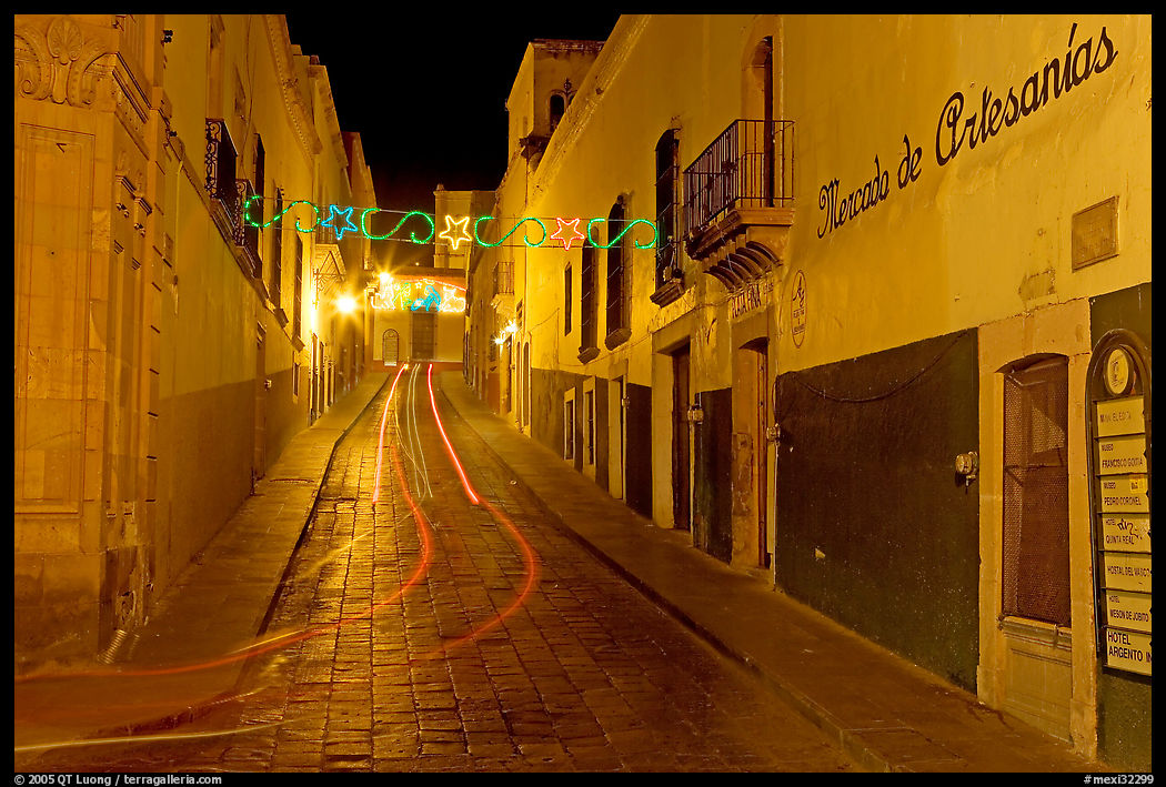 Uphill paved street by night with light trail. Zacatecas, Mexico