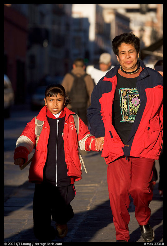 Mother and daughter on a sidewalk. Zacatecas, Mexico