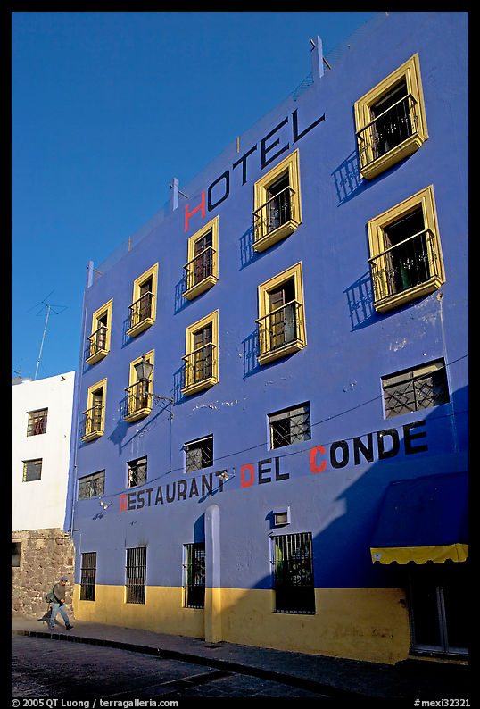 Hotel restaurant building painted bright blue and yellow. Guanajuato, Mexico
