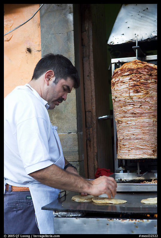 Man preparing tacos with meat. Guanajuato, Mexico