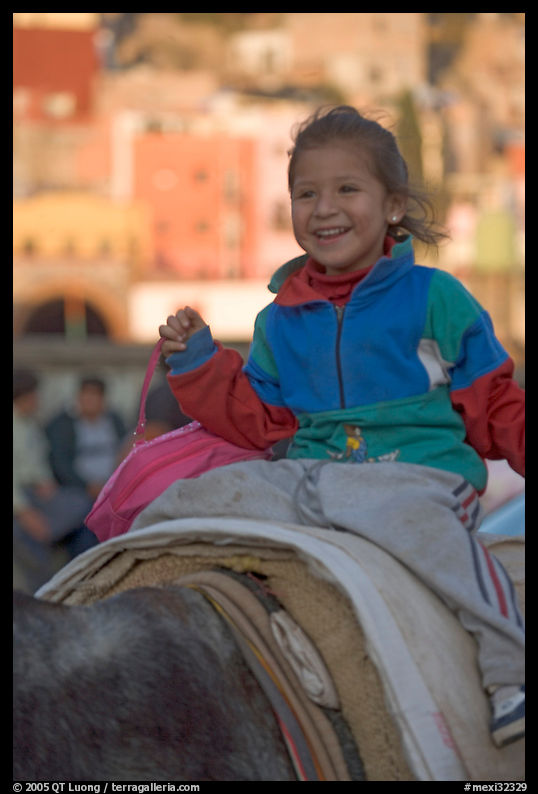 Girl riding a donkey. Guanajuato, Mexico