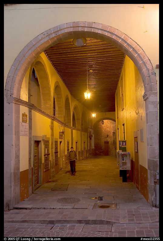 Man walking in an arched passage a dawn. Guanajuato, Mexico