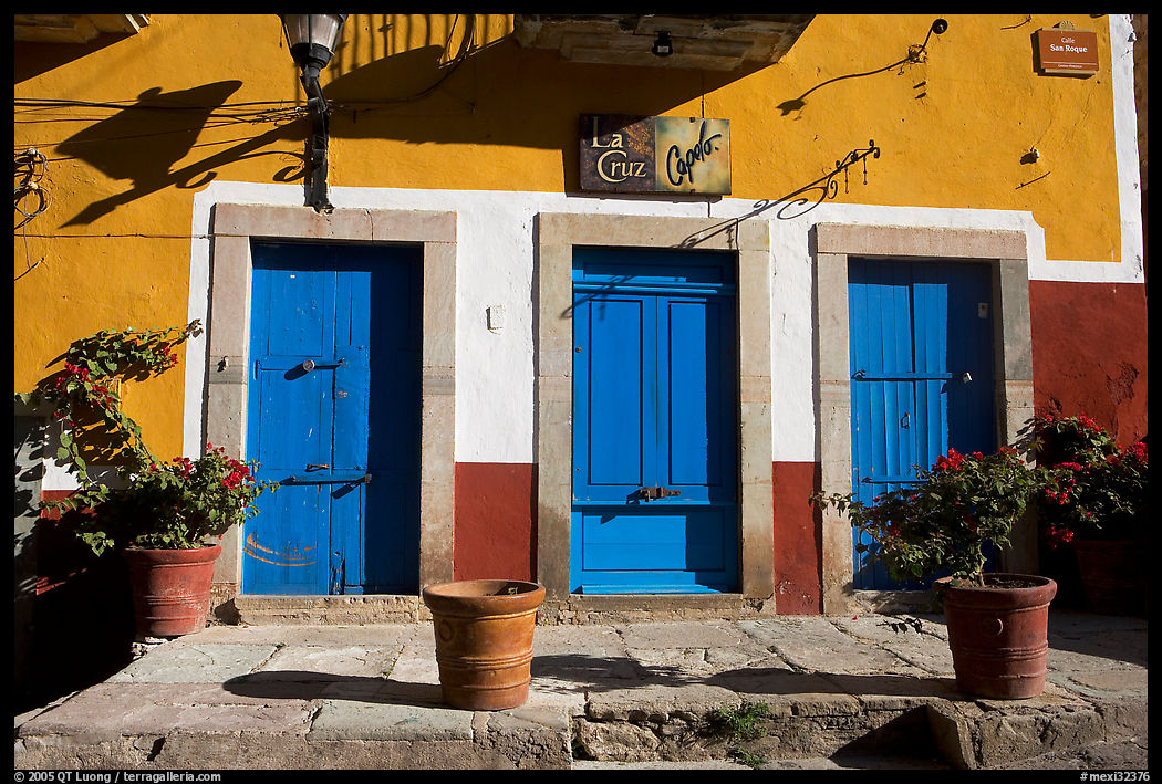 Blue doors and yellow wall on Plaza San Roque. Guanajuato, Mexico