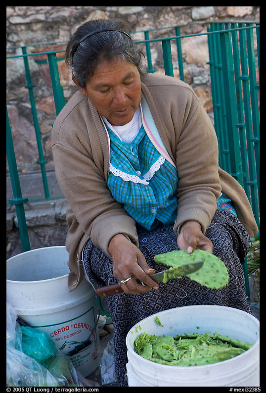 Woman peeling cactus. Guanajuato, Mexico