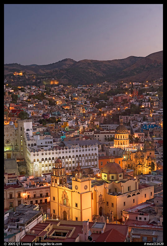 Panoramic view of the historic town with illuminated basilic, university, and La Compania. Guanajuato, Mexico