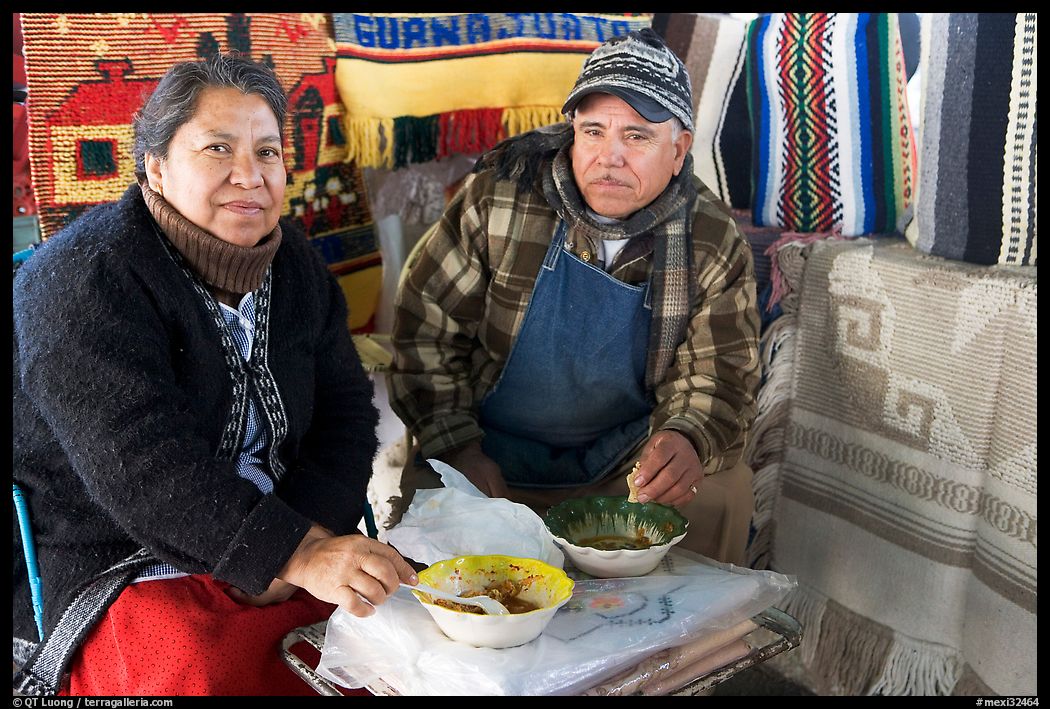 Couple eating in the street. Guanajuato, Mexico