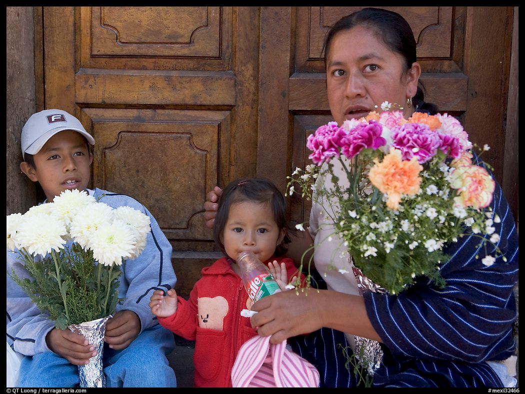 Woman with two children sitting in doorway. Guanajuato, Mexico