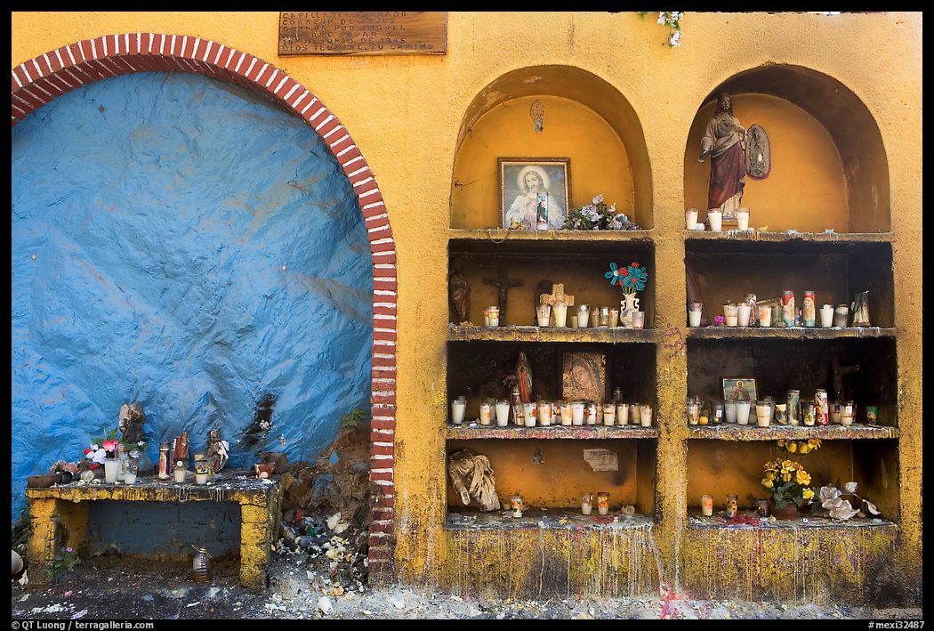 The exterior wall of a roadside chapel. Mexico