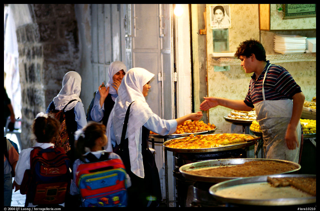 Muslem women purchasing sweets. Jerusalem, Israel