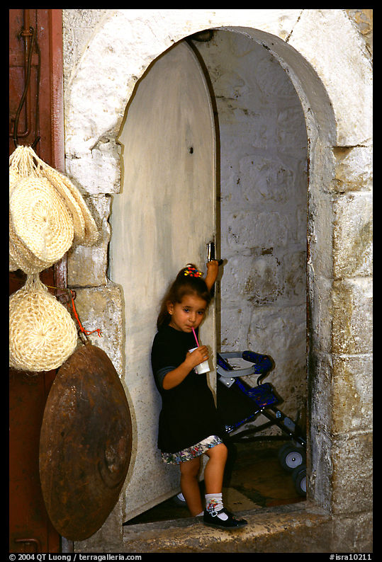Girl in a doorway. Jerusalem, Israel