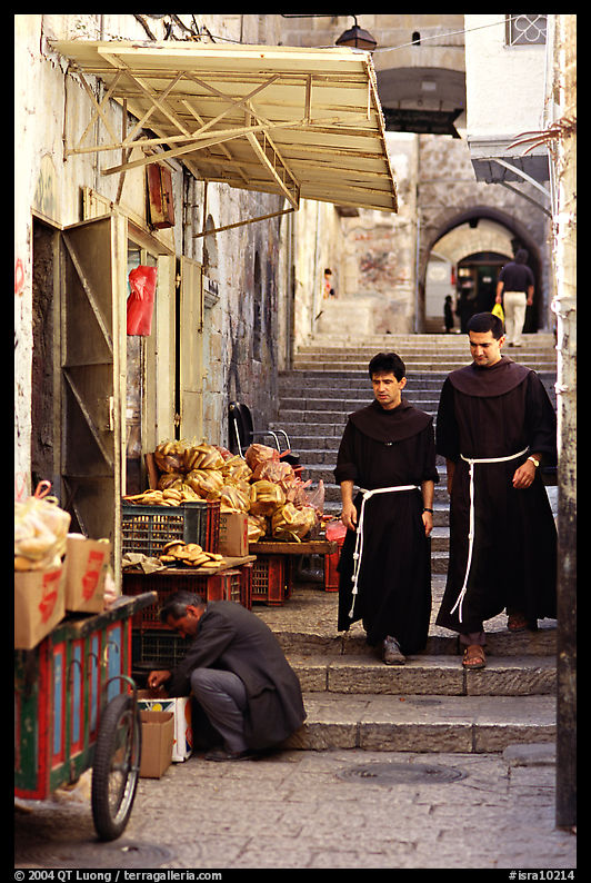 Two christian monks in a narrow alley. Jerusalem, Israel