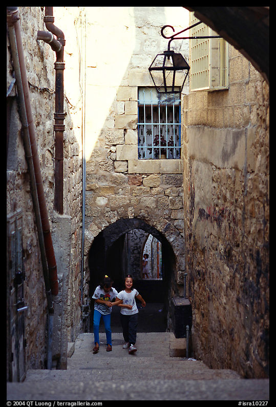 Children on stairs of an old alley. Jerusalem, Israel