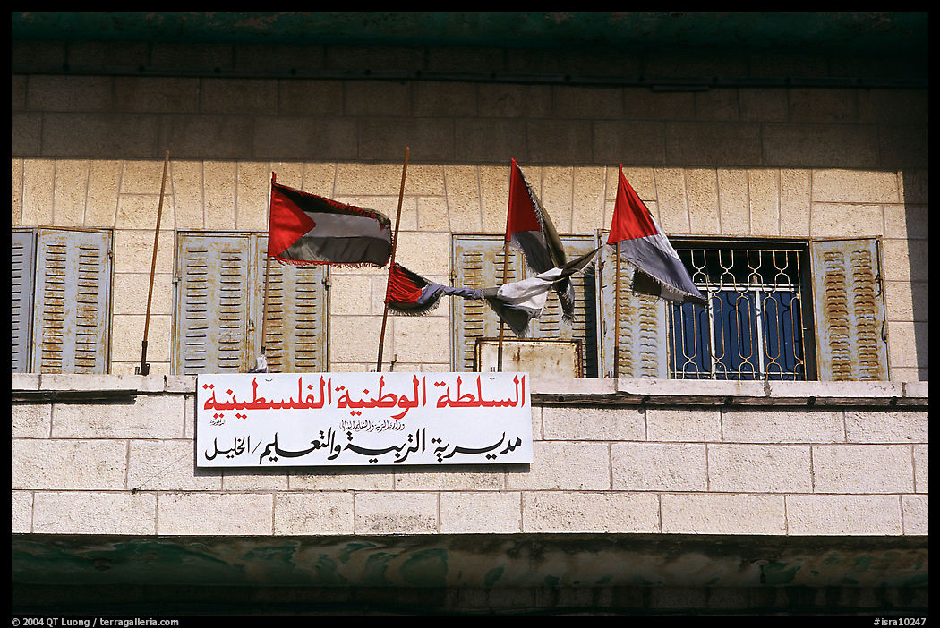 Palestinian flags and inscriptions in arabic in front of a school, East Jerusalem. Jerusalem, Israel