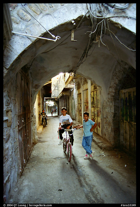 Two children under an archway, Hebron. West Bank, Occupied Territories (Israel)