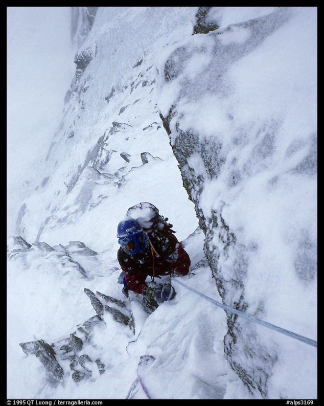 Frank Levy during a storm,  North face of Les Droites,  Mont-Blanc Range, French Alps.