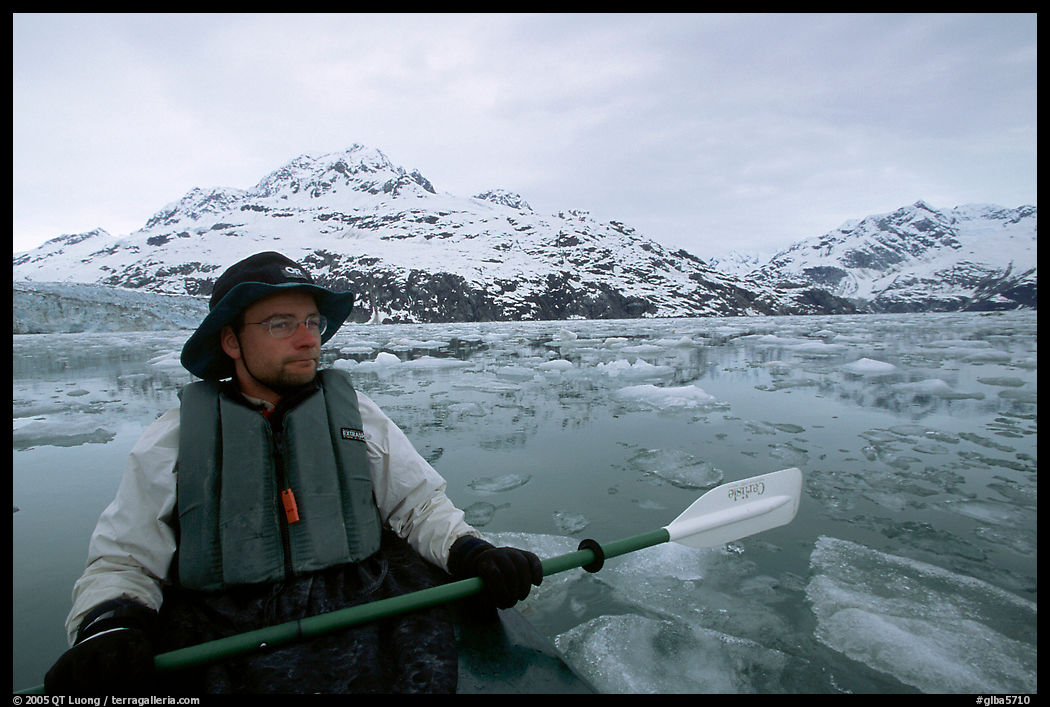 Kayaker on ice-chocked waters close to John Hopkins Inlet. Glacier Bay National Park, Alaska