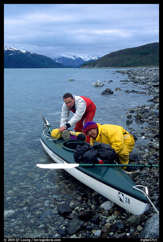 Kayaker packing tight into a double kayak. Glacier Bay National Park, Alaska