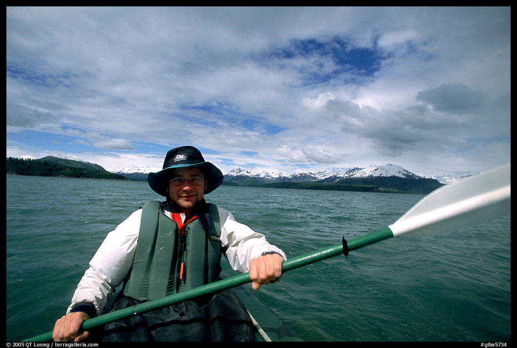 Kayaker paddling in Muir Inlet. Glacier Bay National Park, Alaska