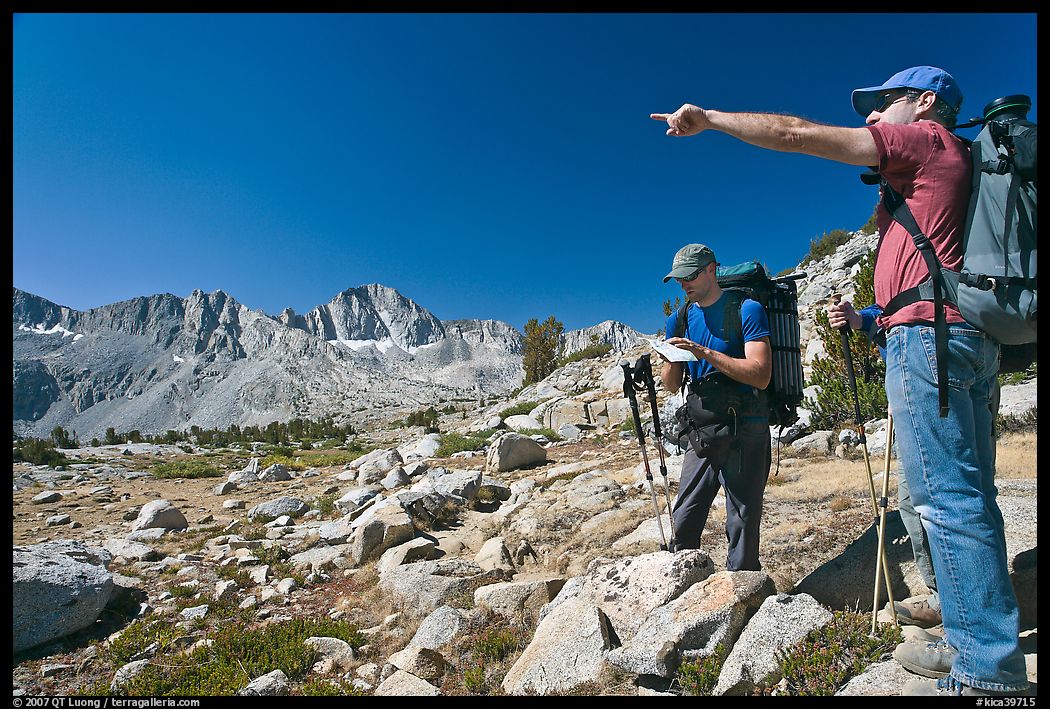 Hikers looking at map and pointing, Dusy Basin. Kings Canyon National Park, California