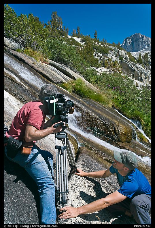 Men filming a waterfall, lower Dusy Basin. Kings Canyon National Park, California