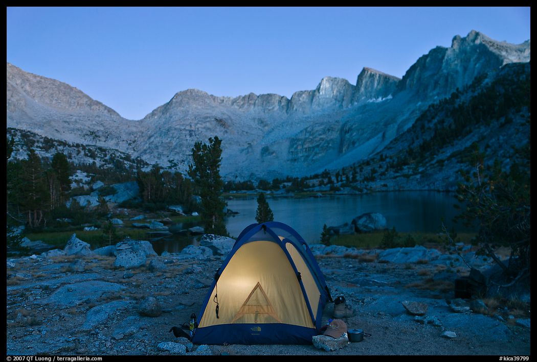 Tent with light and Palisades at dusk, lower Dusy Basin. Kings Canyon National Park, California