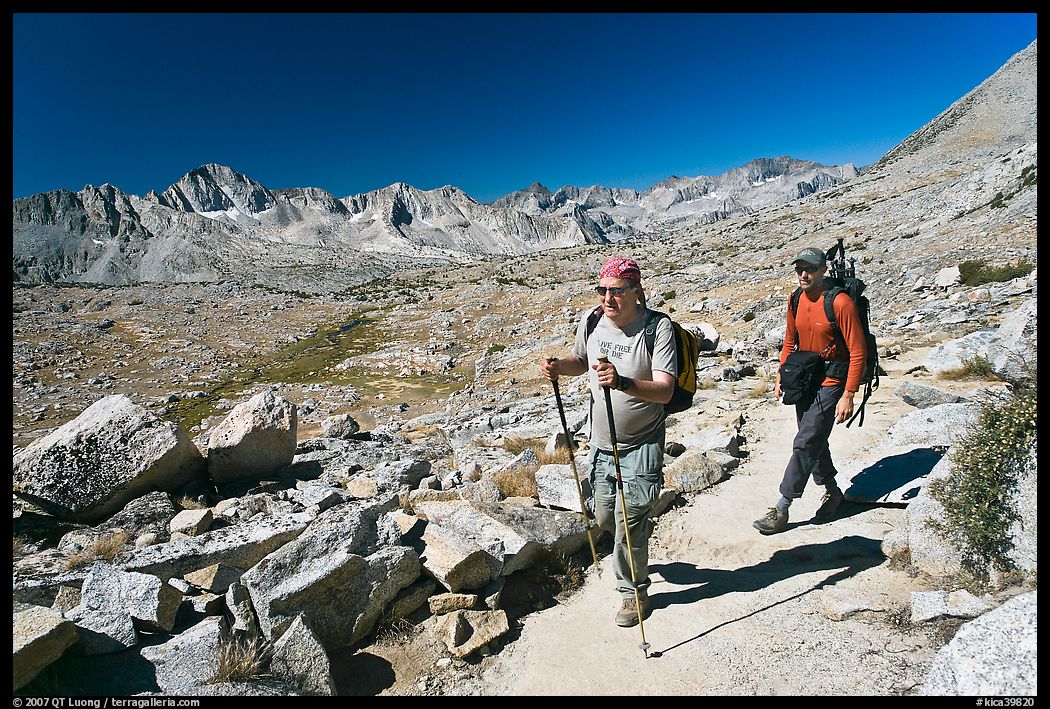 Hikers on trail below Biship Pass, Dusy Basin. Kings Canyon National Park, California