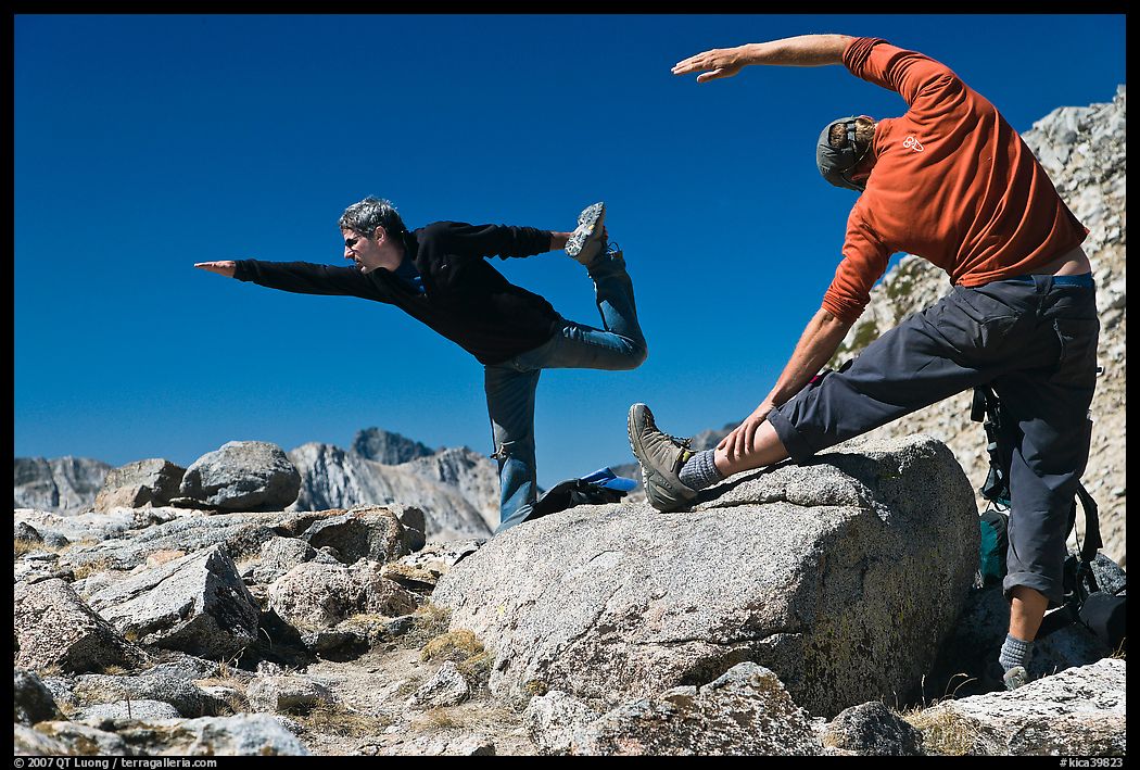 Hikers doing stretching exercises, Bishop Pass. Kings Canyon National Park, California