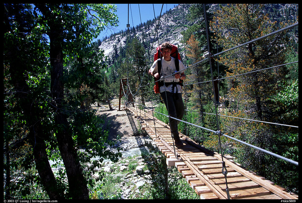 Crossing a river on a suspension footbridge. Kings Canyon National Park, California