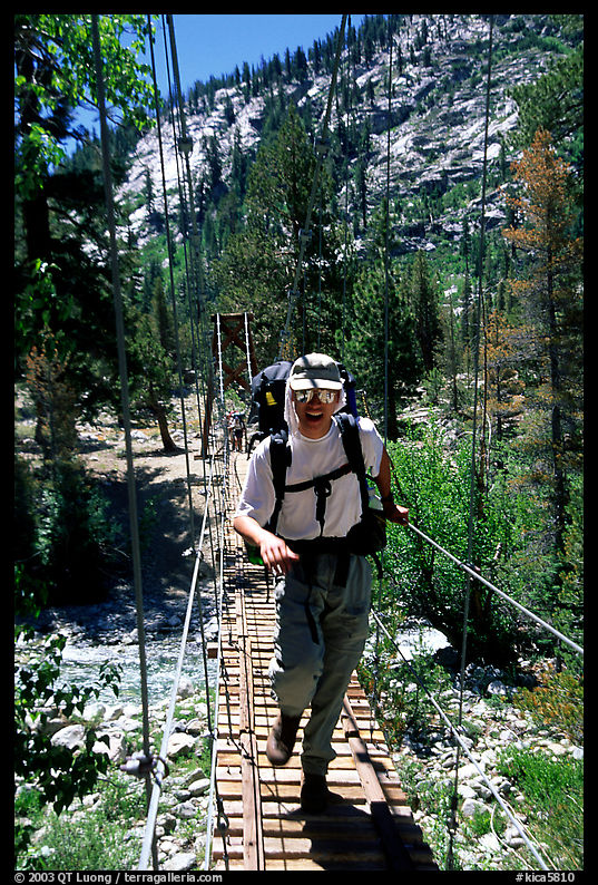 Crossing a river on a suspension bridge. Kings Canyon National Park, California